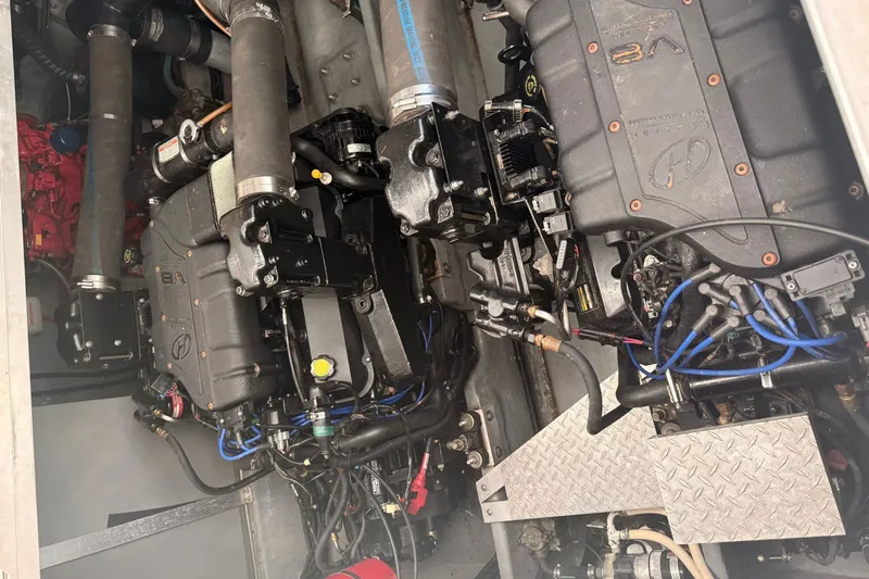 Slide: The Image of Engine compartment of a 1999 Sea Ray 380 Sundancer boat, showcasing mechanical components. - 32