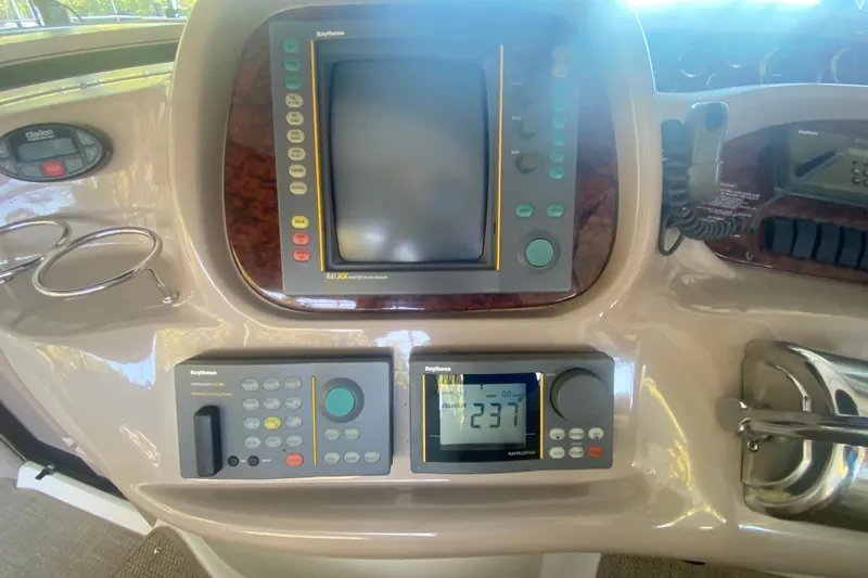 Slide: The Image of Control panel of a 1999 Sea Ray 380 Sundancer boat with navigation equipment. - 24