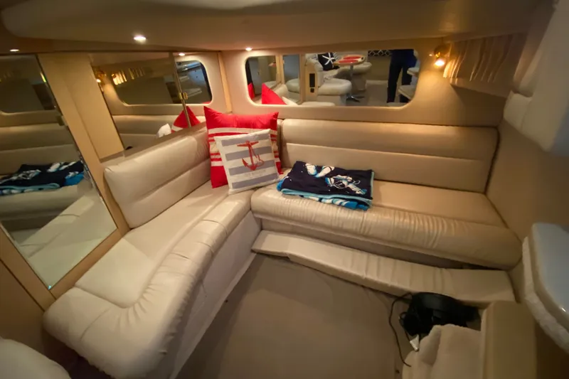 Slide: The Image of Luxurious interior of 1999 Sea Ray 380 Sundancer yacht with plush seating and nautical decor. - 35