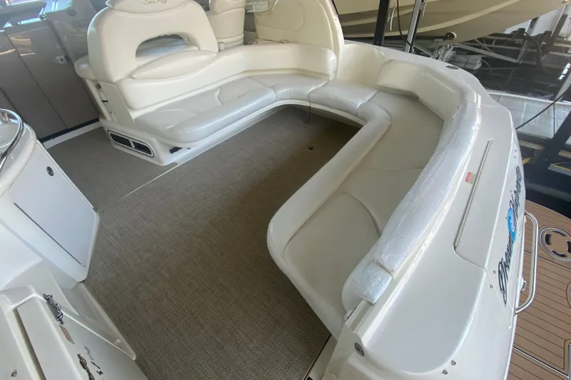 Slide: The Image of 1999 Sea Ray 380 Sundancer boat interior with spacious white seating area. - 20
