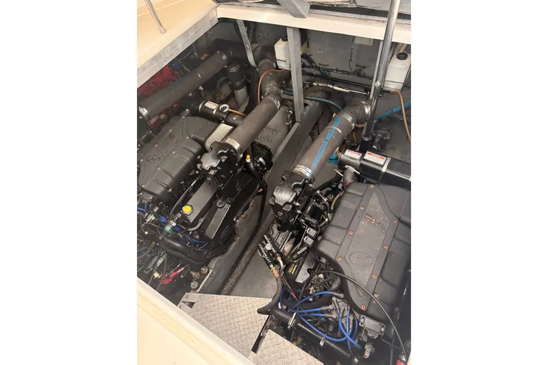 Slide: The Image of Engine compartment of a 1999 Sea Ray 380 Sundancer boat, showcasing dual engines. - 40