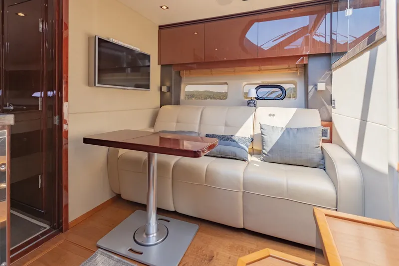 Slide: The Image of Luxurious interior of 2015 Sea Ray 470 Sundancer yacht with plush seating and modern decor. - 22