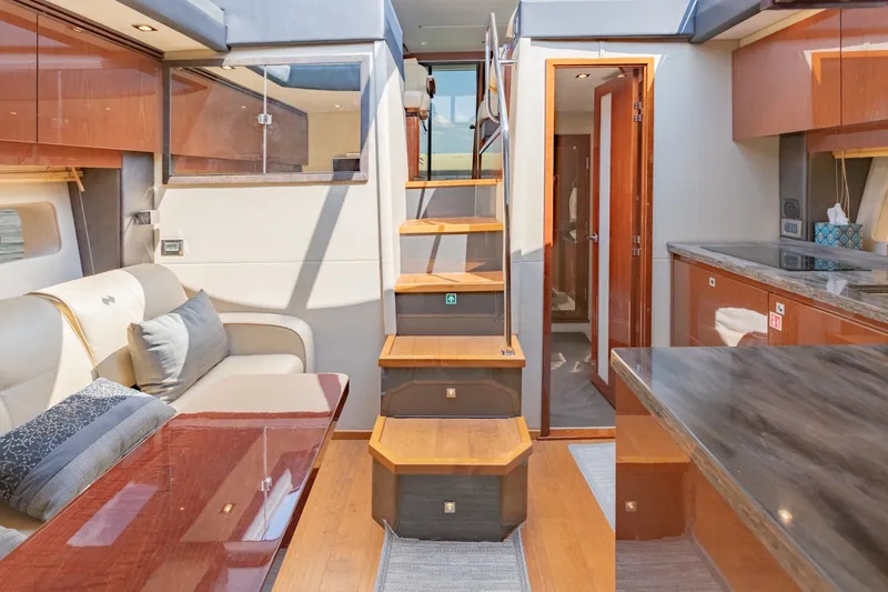 Slide: The Image of Luxurious interior of 2015 Sea Ray 470 Sundancer yacht with elegant wood finishes and modern design. - 18