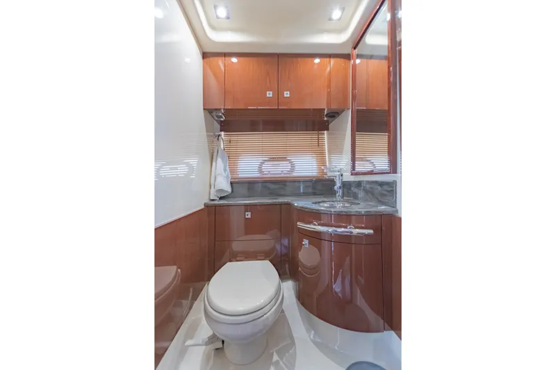 Slide: The Image of Luxurious bathroom interior of 2015 Sea Ray 470 Sundancer yacht with wood cabinetry. - 28