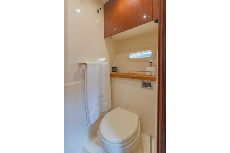 Slide: The Image of Luxurious bathroom in 2015 Sea Ray 470 Sundancer yacht with modern amenities. - 31