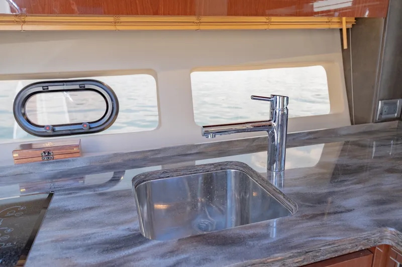 Slide: The Image of Luxury kitchen sink on 2015 Sea Ray 470 Sundancer yacht with sleek countertop design. - 21