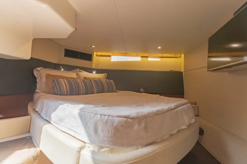 Slide: The Image of Luxurious bedroom interior of 2015 Sea Ray 470 Sundancer yacht with cozy bedding. - 29