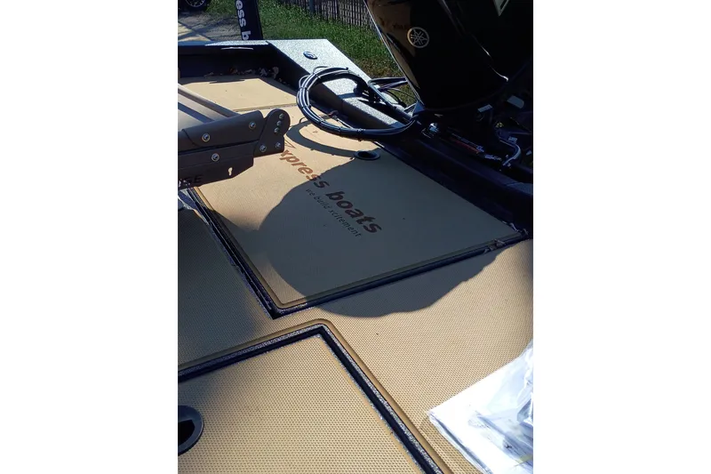 Slide: The Image of 2026 EXPRESS BOAT EXPRESS H18C deck with Yamaha motor and storage compartments. - 11