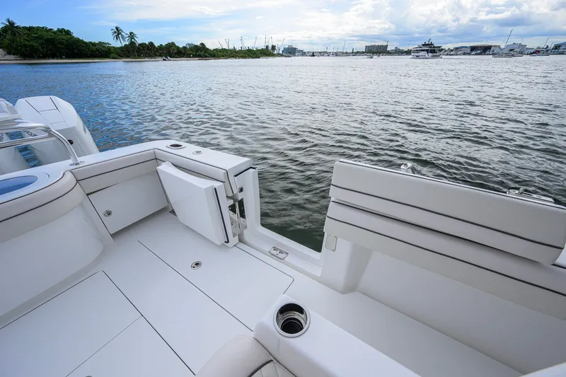 Slide: The Image of 2026 Valhalla V-41 boat deck overlooking serene waterfront with distant yachts. - 46