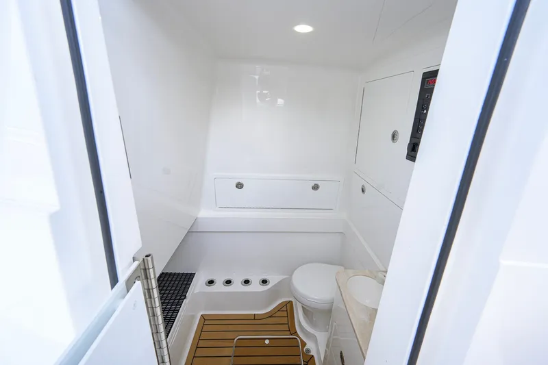 Slide: The Image of Modern bathroom interior of 2026 Valhalla V-41 boat, featuring sleek design and wooden flooring. - 56