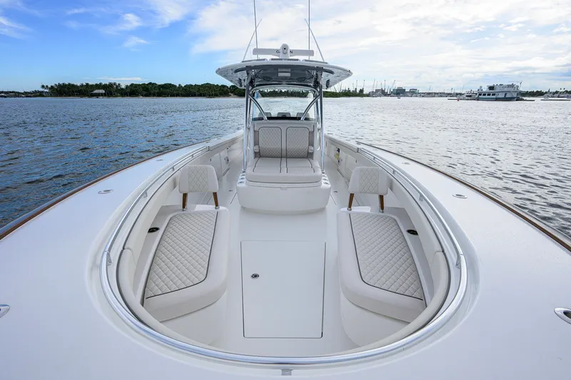 Slide: The Image of 2026 Valhalla V-41 boat interior with luxurious seating on a calm water backdrop. - 31
