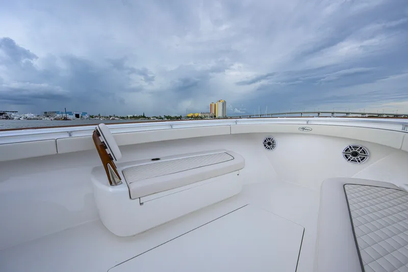 Slide: The Image of Luxurious 2026 Valhalla V-41 boat interior with cushioned seating and scenic waterfront view. - 28