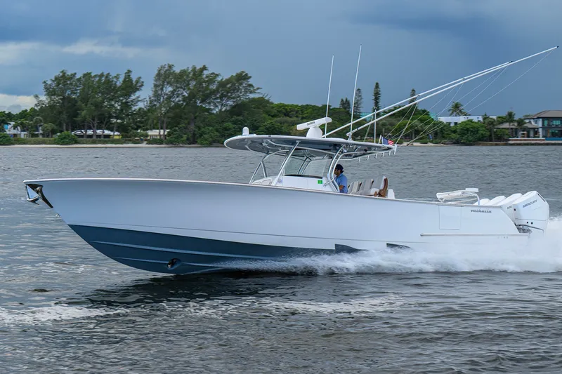 Slide: The Image of 2026 Valhalla V-41 boat cruising on water, showcasing sleek design and powerful engines. - 4