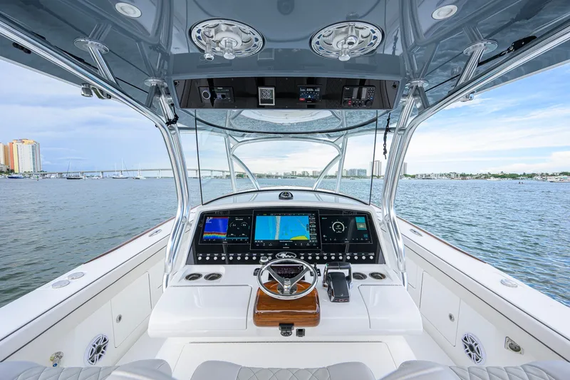 Slide: The Image of Cockpit view of 2026 Valhalla V-41 boat with advanced navigation systems on open water. - 1