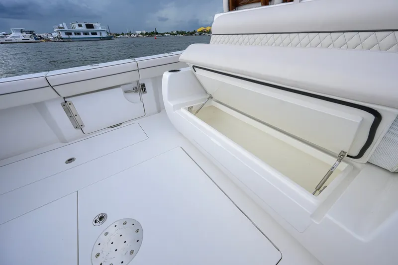 Slide: The Image of Valhalla V-41 2026 boat deck with open storage compartment, featuring sleek white design. - 49
