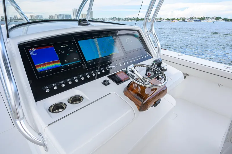 Slide: The Image of Valhalla V-41 2026 boat dashboard with advanced navigation screens and steering wheel. - 17