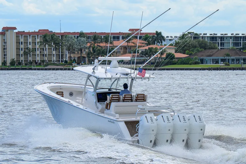 Slide: The Image of 2026 Valhalla V-41 boat cruising on water with multiple outboard engines. - 15
