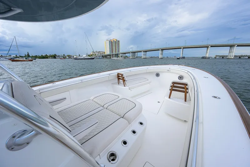 Slide: The Image of Luxurious 2026 Valhalla V-41 boat interior with plush seating, overlooking a scenic waterfront. - 36