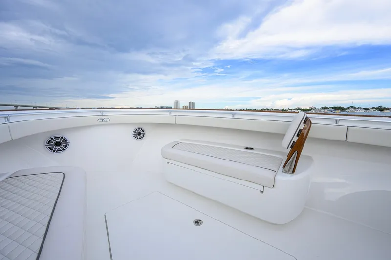 Slide: The Image of Luxurious 2026 Valhalla V-41 boat interior with white seating and scenic sky view. - 27