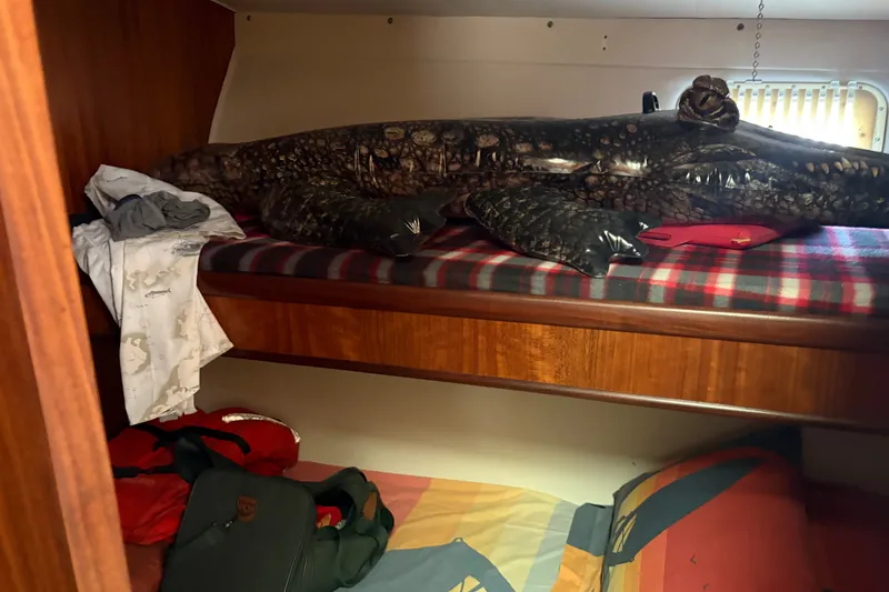 Slide: The Image of Cabin interior of 1972 Hatteras 38 Convertible with bunk beds and nautical decor. - 28