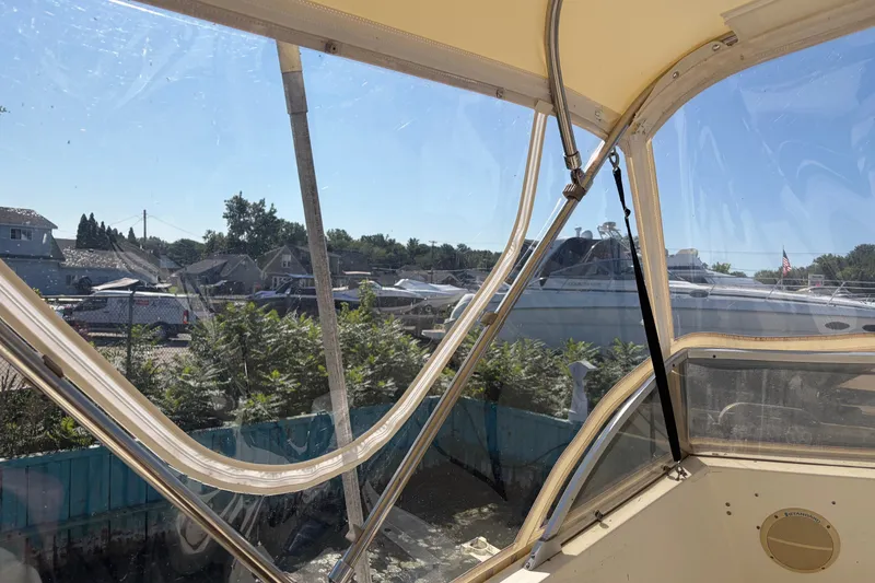 Slide: The Image of View from 1972 Hatteras 38 Convertible boat, showcasing marina and surrounding landscape. - 11