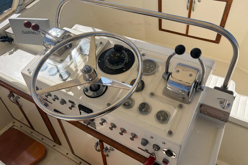 Slide: The Image of Helm of 1972 Hatteras 38 Convertible boat with steering wheel and navigation instruments. - 9
