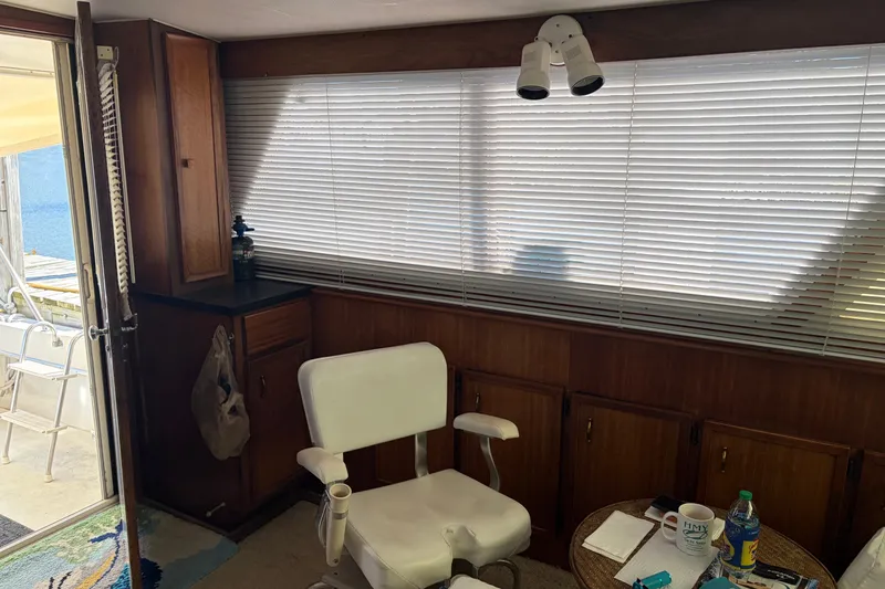 Slide: The Image of Interior of a 1972 Hatteras 38 Convertible boat with seating and blinds. - 23