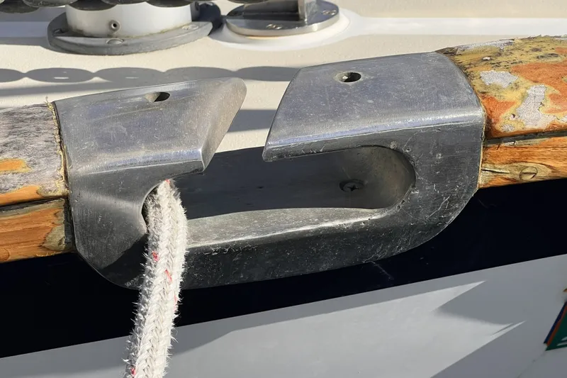 Slide: The Image of Close-up of a 1995 Cabo Rico 34 boat's metal cleat with rope. - 8