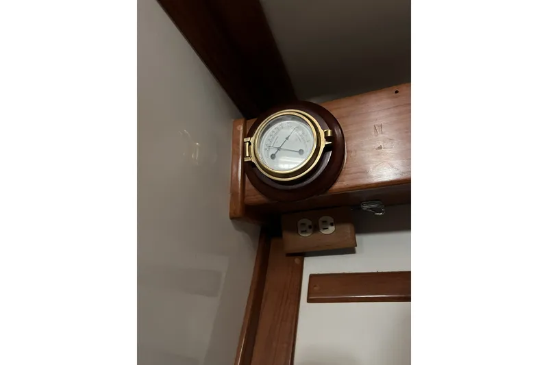 Slide: The Image of Barometer on wooden panel inside 1995 Cabo Rico 34 sailboat cabin. - 68