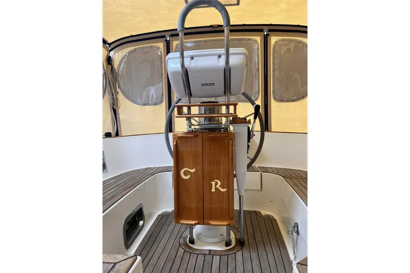 Slide: The Image of Cockpit of 1995 Cabo Rico 34 sailboat with wooden accents and steering wheel. - 28