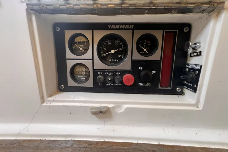 Slide: The Image of Control panel of a 1995 Cabo Rico 34 sailboat featuring Yanmar engine gauges. - 30