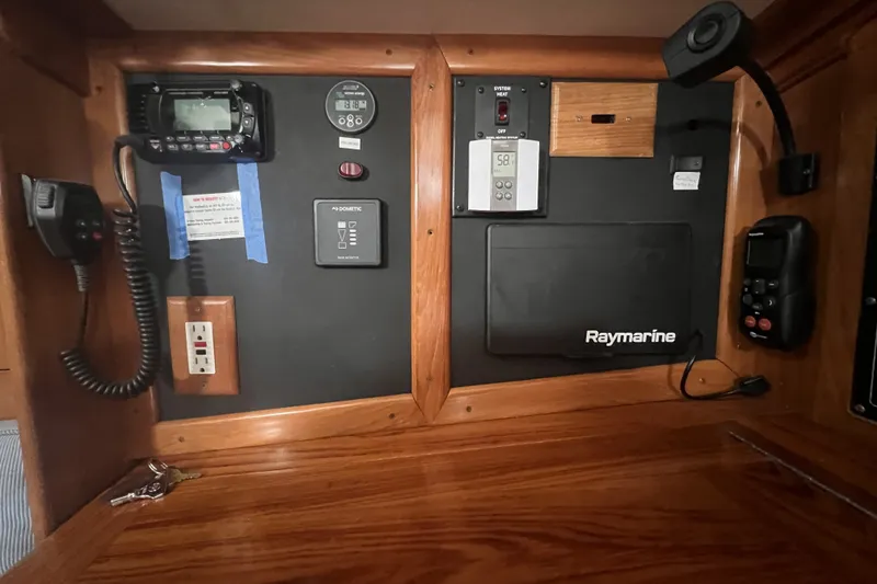 Slide: The Image of Control panel of a 1995 Cabo Rico 34 sailboat with Raymarine equipment. - 49