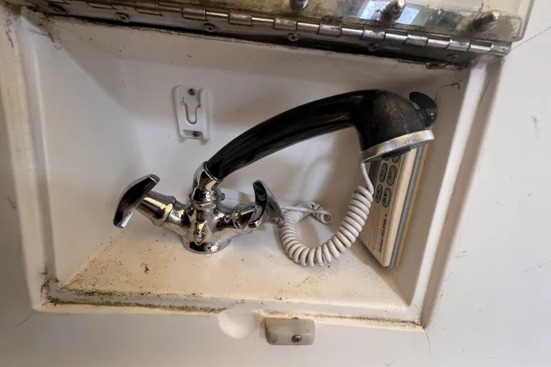 Slide: The Image of Built-in shower faucet and handset in a 1995 Cabo Rico 34 yacht. - 29