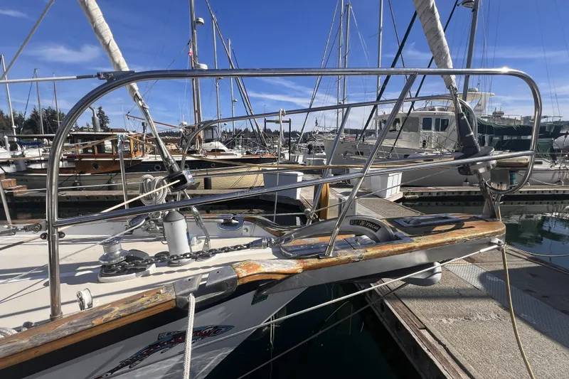 Slide: The Image of Sailboat docked at marina, Cabo Rico 34, 1995 model, with clear blue sky. - 6