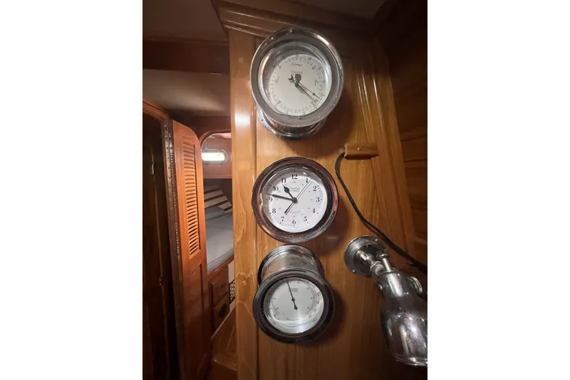 Slide: The Image of Interior of 1995 Cabo Rico 34 yacht with nautical instruments and wooden paneling. - 44