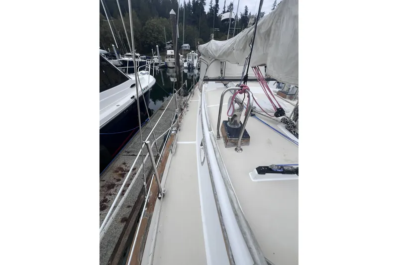 Slide: The Image of Sailboat deck view of 1995 Cabo Rico 34 docked at marina. - 18
