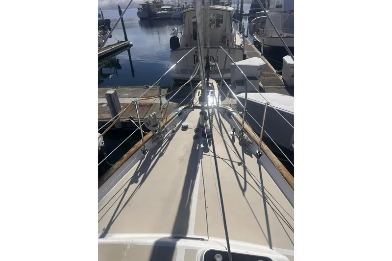 Slide: The Image of Sailboat deck view of 1995 Cabo Rico 34 docked at marina. - 9