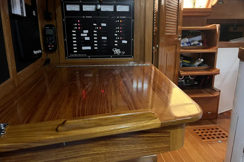 Slide: The Image of Interior of a 1995 Cabo Rico 34 yacht with wooden cabinetry and control panel. - 47