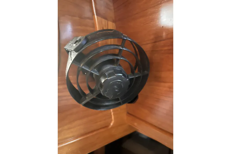 Slide: The Image of Black fan mounted on wooden interior of 1995 Cabo Rico 34 yacht. - 61