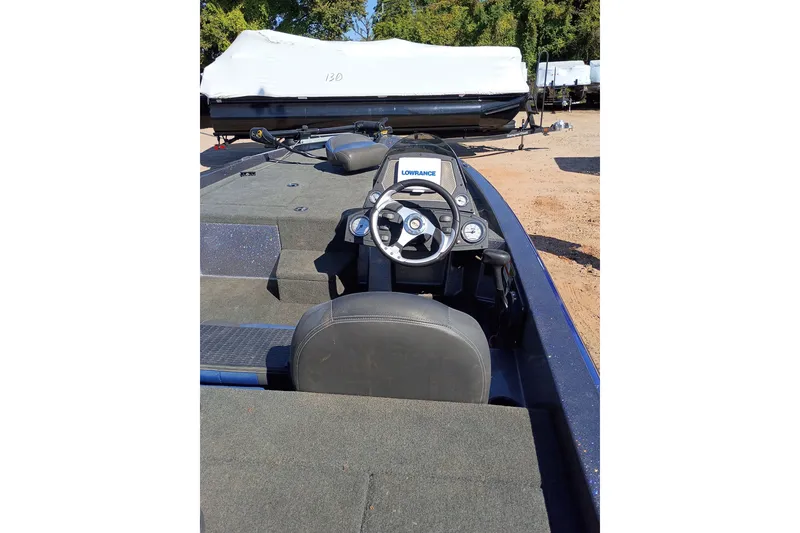 Slide: The Image of 2017 Stratos 176 VLO boat interior with steering wheel and Lowrance system. - 11