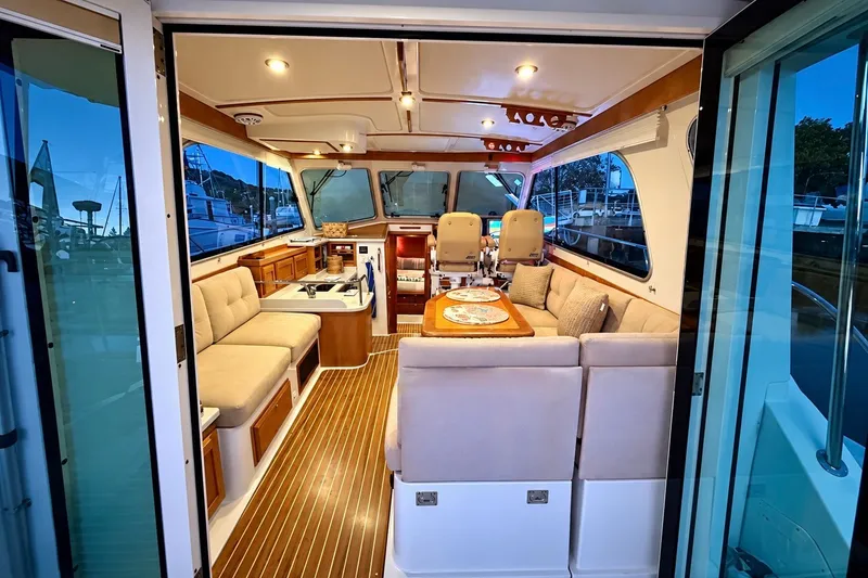 Slide: The Image of Luxurious interior of a 2011 Back Cove 37 yacht with elegant seating and wooden flooring. - 10