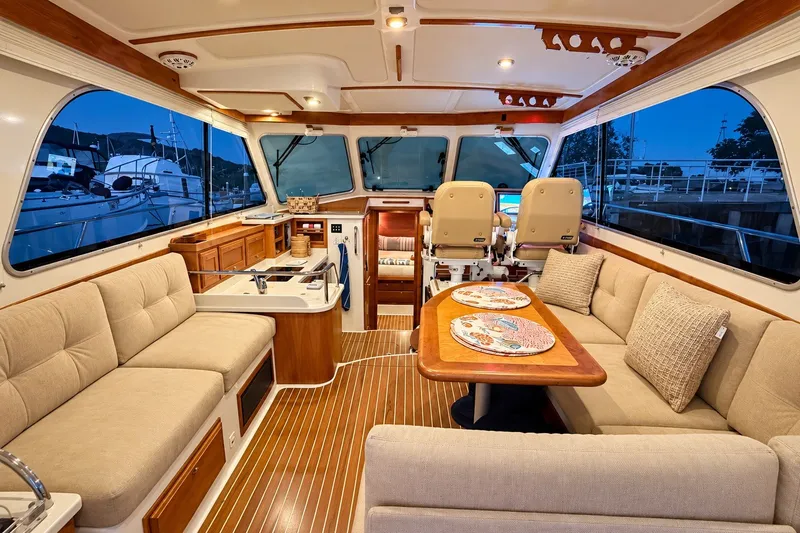 Slide: The Image of Luxurious interior of 2011 Back Cove 37 yacht with elegant seating and dining area. - 12