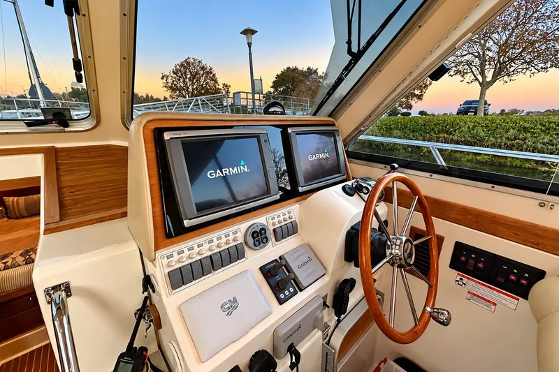 Slide: The Image of Helm of 2011 Back Cove 37 boat with Garmin navigation system at sunset. - 13