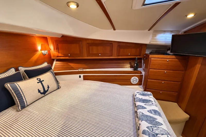 Slide: The Image of Luxurious cabin interior of 2011 Back Cove 37 yacht with nautical decor and wood finish. - 29