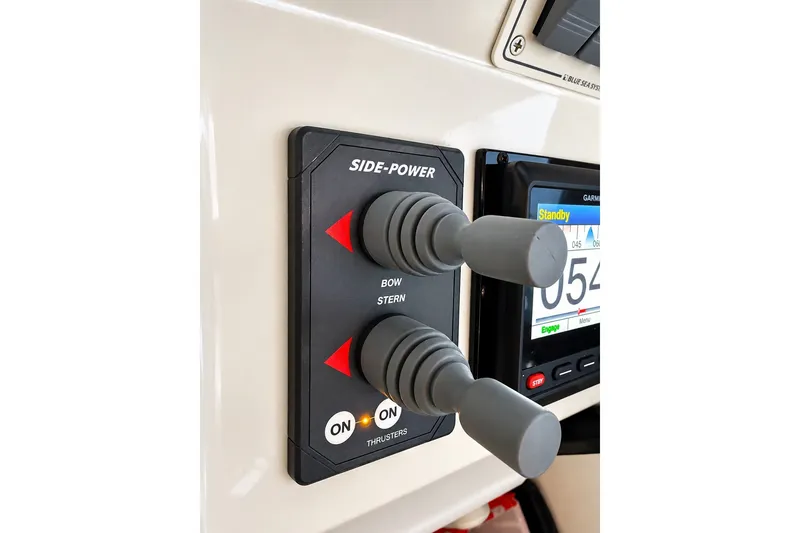 Slide: The Image of Control panel of a 2011 Back Cove 37 boat with Side-Power thrusters. - 17