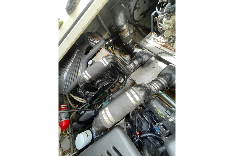 Slide: The Image of Engine compartment of a 2002 Silverton 330 Sport Bridge with MerCruiser components. - 41