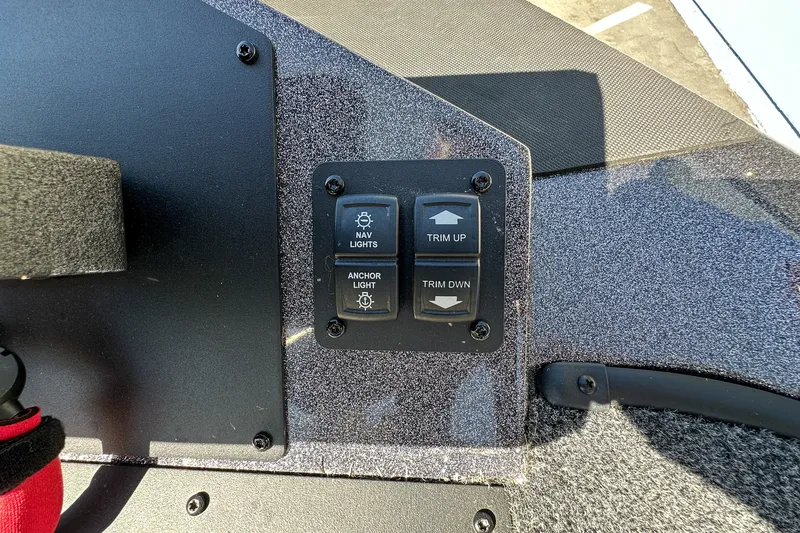 Slide: The Image of Control panel of 2025 Ranger Z185 boat with navigation and trim switches. - 14