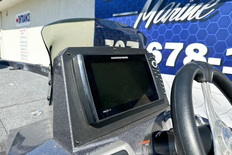 Slide: The Image of Helix 10 fishfinder on 2025 Ranger Z185 boat dashboard, near marine dealership. - 8