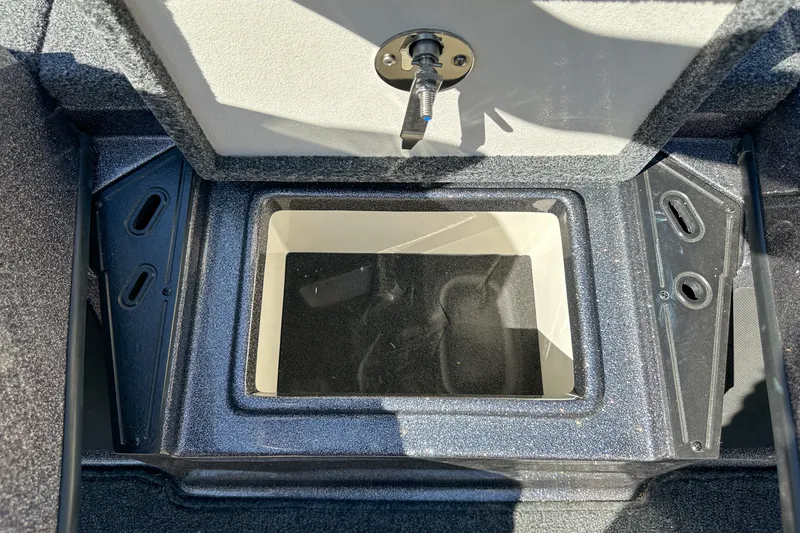 Slide: The Image of Open storage compartment in 2025 Ranger Z185 boat, featuring a secure latch mechanism. - 20