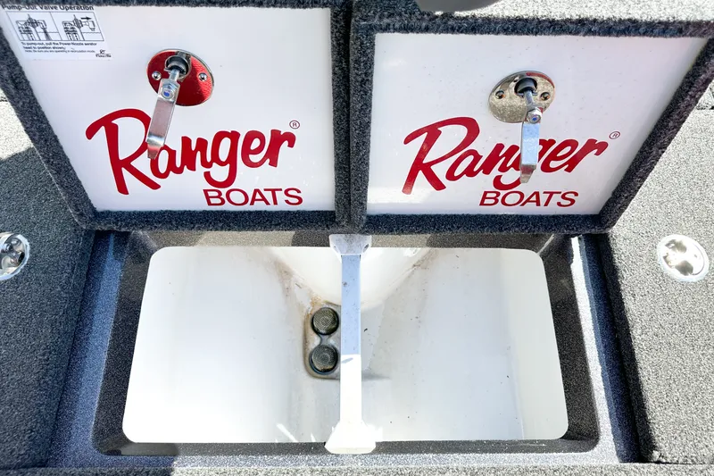 Slide: The Image of Open storage compartment of 2025 Ranger Z185 boat with Ranger Boats branding. - 21